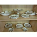 A dessert set by Royal Worcester, consisting of a comport, 6 plates, two small shell shaped