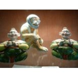 A porcelain monkey figure along with a pair of seated Oriental style nodding figures (1 A/F)