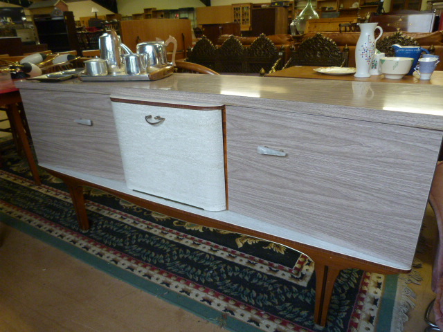 A Mid-century veneered sideboard with cabinet in