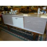 A Mid-century veneered sideboard with cabinet in