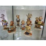 A quantity of various Hummel figurines (8)
