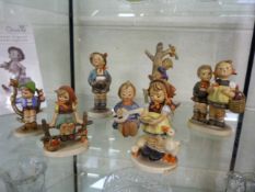 A quantity of various Hummel figurines (8)