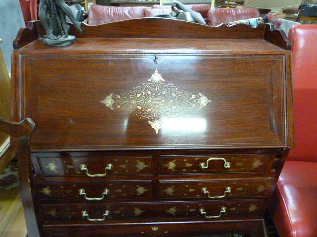 A modern bureau inlaid with brass detailing on stand with cabriole legs