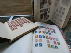 Three stamp albums containing various countries stamps