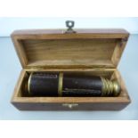 A leather bound four draw telescope