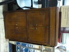 An oak music cabinet with record player inside