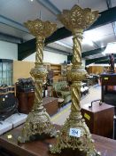 A pair of ornate Church candlesticks