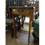 An oak drop leaf table