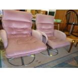 A Pair of pink mid century swivel chairs