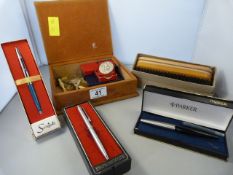 A box containing pens, medals and other pieces etc