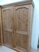 A pine wardrobe/cupboard- key in office