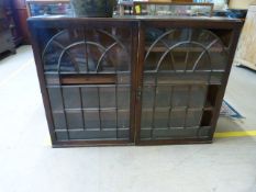 An oak cabinet with glass panes