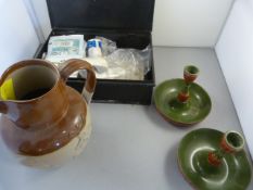 A Vintage first aid tin, candlesticks and an earthenware jug