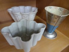Two jelly moulds including 'Shelly' and a Cook's measure