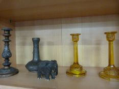 A pair of Amber coloured candlesticks (1A/F), a SCM candlestick and pewter vase