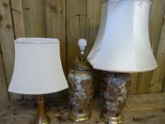 A pair of chinese lamps and one other