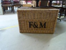 A Large wicker basket marked F M