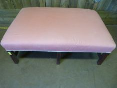 A Large pink upholstered stool