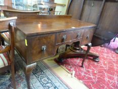 A small mahogany dressing table on cabriole legs