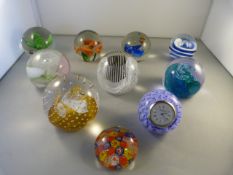 A large quantity of glass paperweights to include Caithness etc