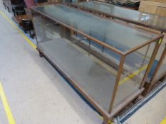 A large shop display counter with oak frame