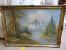 A signed oil painting of a Lake scene