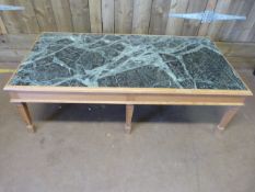 A pine coffee table with marble top