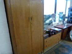 A mid century wardrobe and matching dressing table