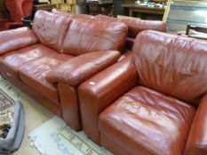 A Red leather three piece suite