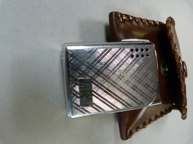 An original Rolls Royce lighter in leather pouch