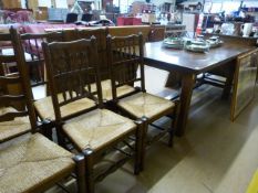 A large oak refrectory table and six chairs