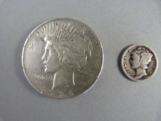 A silver USA 1926 Peace Dollar and a silver USA 1929 Mercury Dime