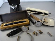 A collection of watches, cuff links and pens including Parker Slimfold pen with 14k nib.