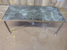 A brass and marble coffee table with lions feet