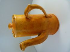 Lidded Coffee Pot with orange glaze marked Baron Barnstaple