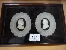 A pair of 19th Century Alabaster silhouettes in mahogany framed case