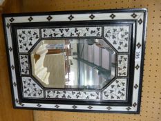A black and white inlaid mirror