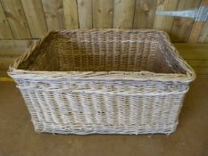 A large rectangular wicker basket