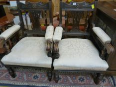 A pair of carved oak upholstered carver chairs
