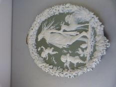 A Green and White Jasperware style plaque of Cherubs and a lady