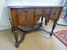 A William & Mary Lowboy. The two plank top inlaid with feather-banding and having a moulded edge.