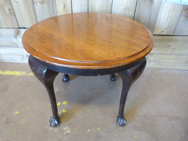 An oak table on cabriole legs