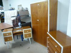 A Mid Century bedroom suite consisting of wardrobe, dressing table and chest of drawers