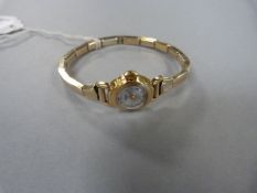 18 carat gold ladies wrist watch with telescopic bracelet, the dial signed ALBONA 17 jewels,