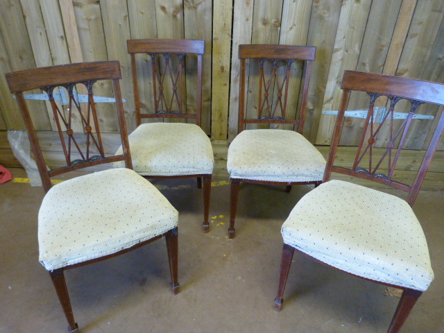 A set of four inlaid Edwardian dining room chairs