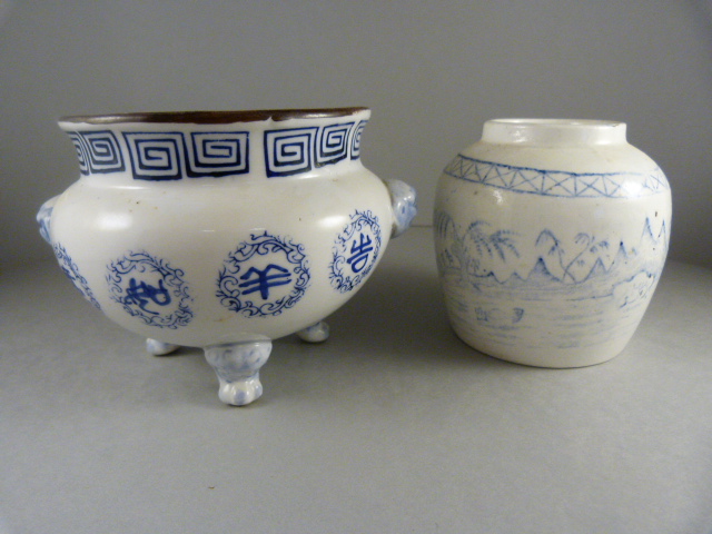 A Chinese censor depicting dragons and a Chinese vase with river and mountain scene.