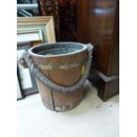 An brass bound oak bucket with rope handle