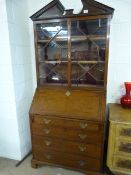 A Bureau on cabriole legs with glass cabinet over