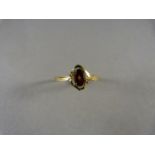 A 9ct Gold Garnet and diamond ring