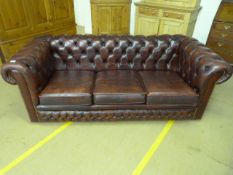 A Red chesterfield sofa